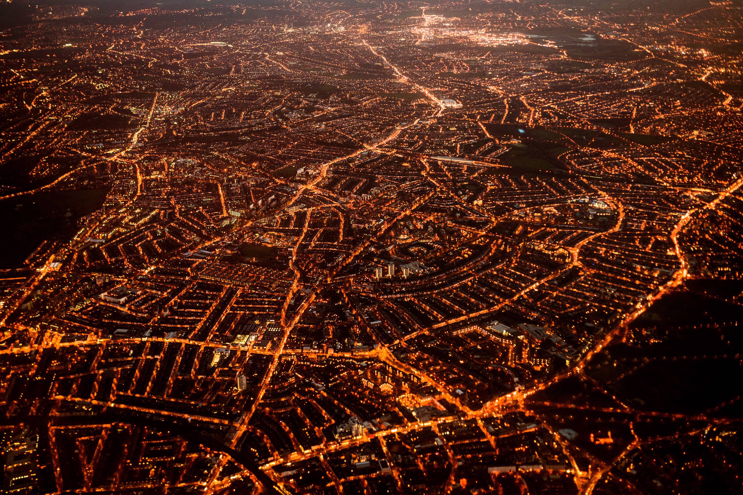 Night time view of London from the air