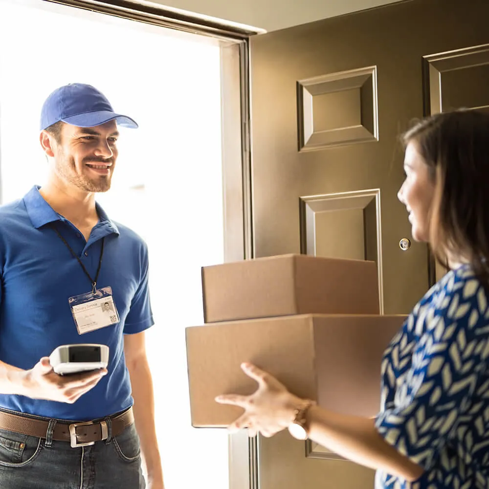 Delivery driver handing over a parcel